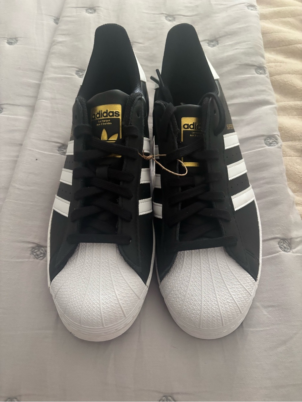 adidas Black & White Shell Toe Classic Sneakers with Gold Accents